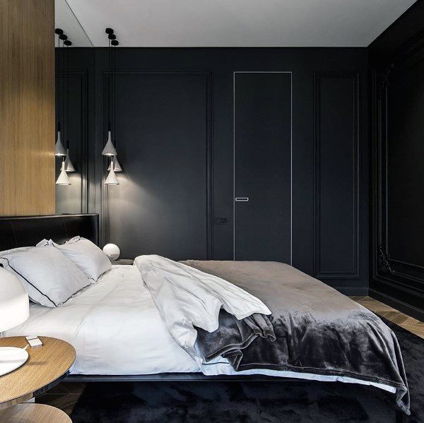 dark small master bedroom with wood accents
