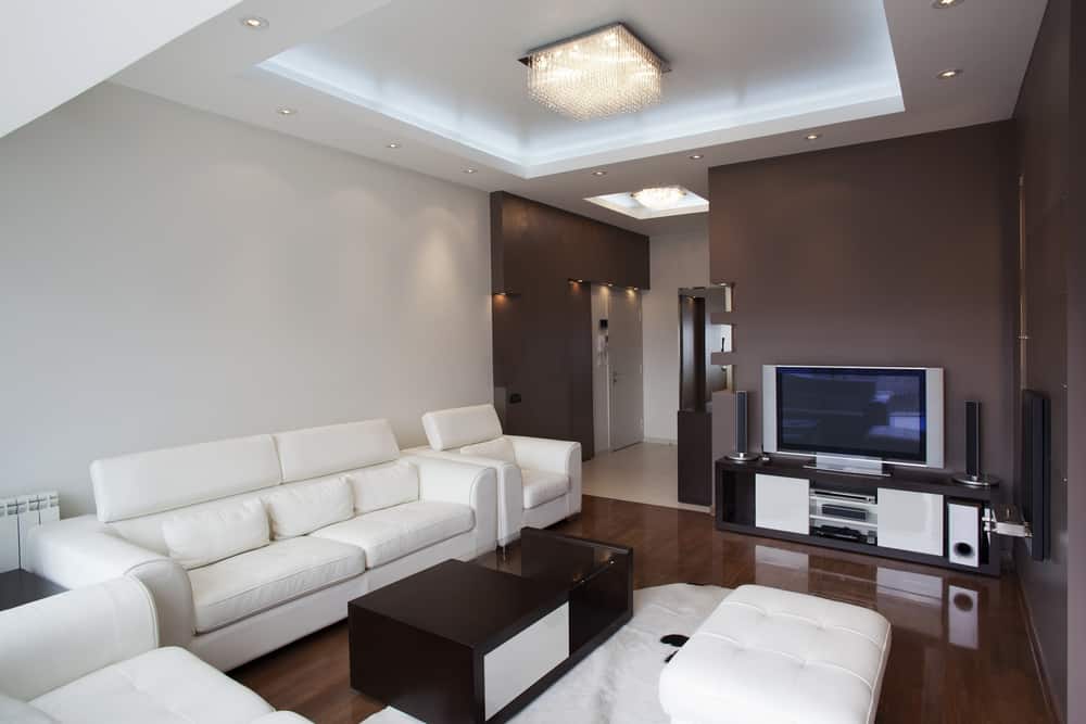 modern apartment living room brown feature wall white couch