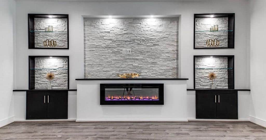 large modern living room electric fireplace exposed brick wall black cupboards 