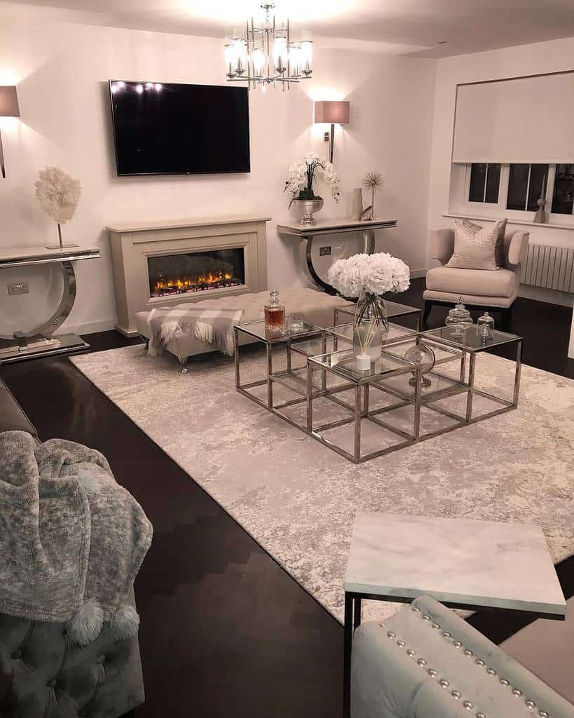 luxury modern living room with electric fireplace wall mounted tv glass square coffee table chandelier