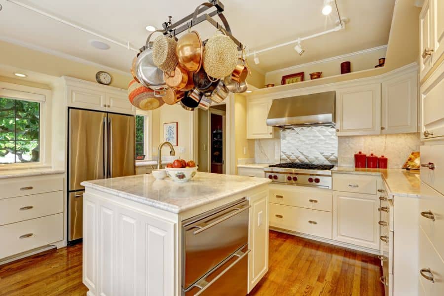 modern french country kitchen white cabinets hanging copper pots 