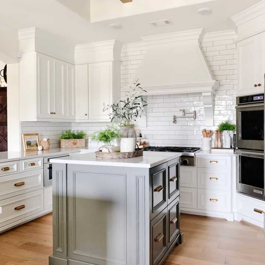 modern french country kitchen white cabinets gray island white subway tile 