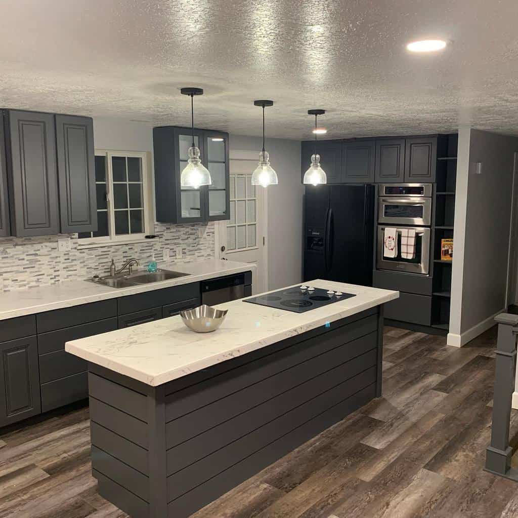 modern kitchen gray cabinets and island white granite countertops track pendant lighting 