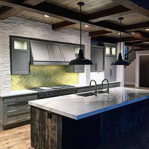 small kitchen with gray cabinets and exposed wood beam ceiling 