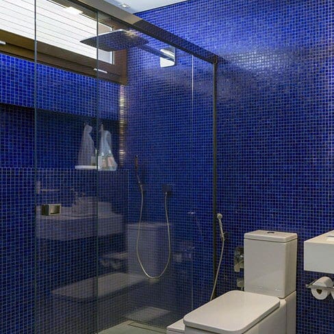 blue mosaic tile bathroom with glass shower 