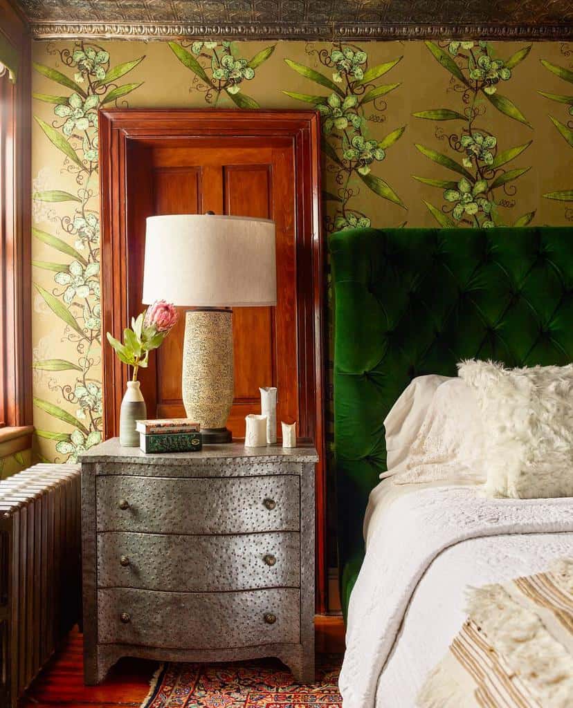 nature inspired bedroom wallpaper green velvet headboard brown door