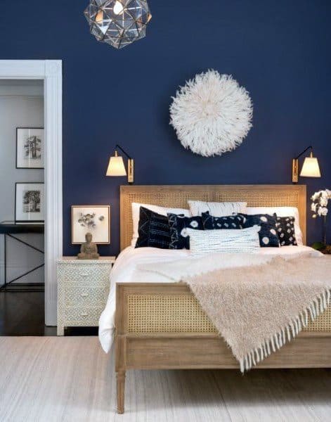 modern boho minimalist bedroom blue feature wall wood bed 