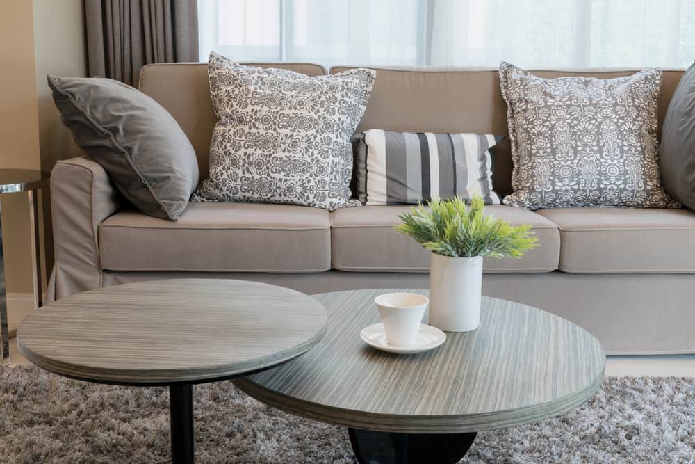gray sofa pattern pillows small tables