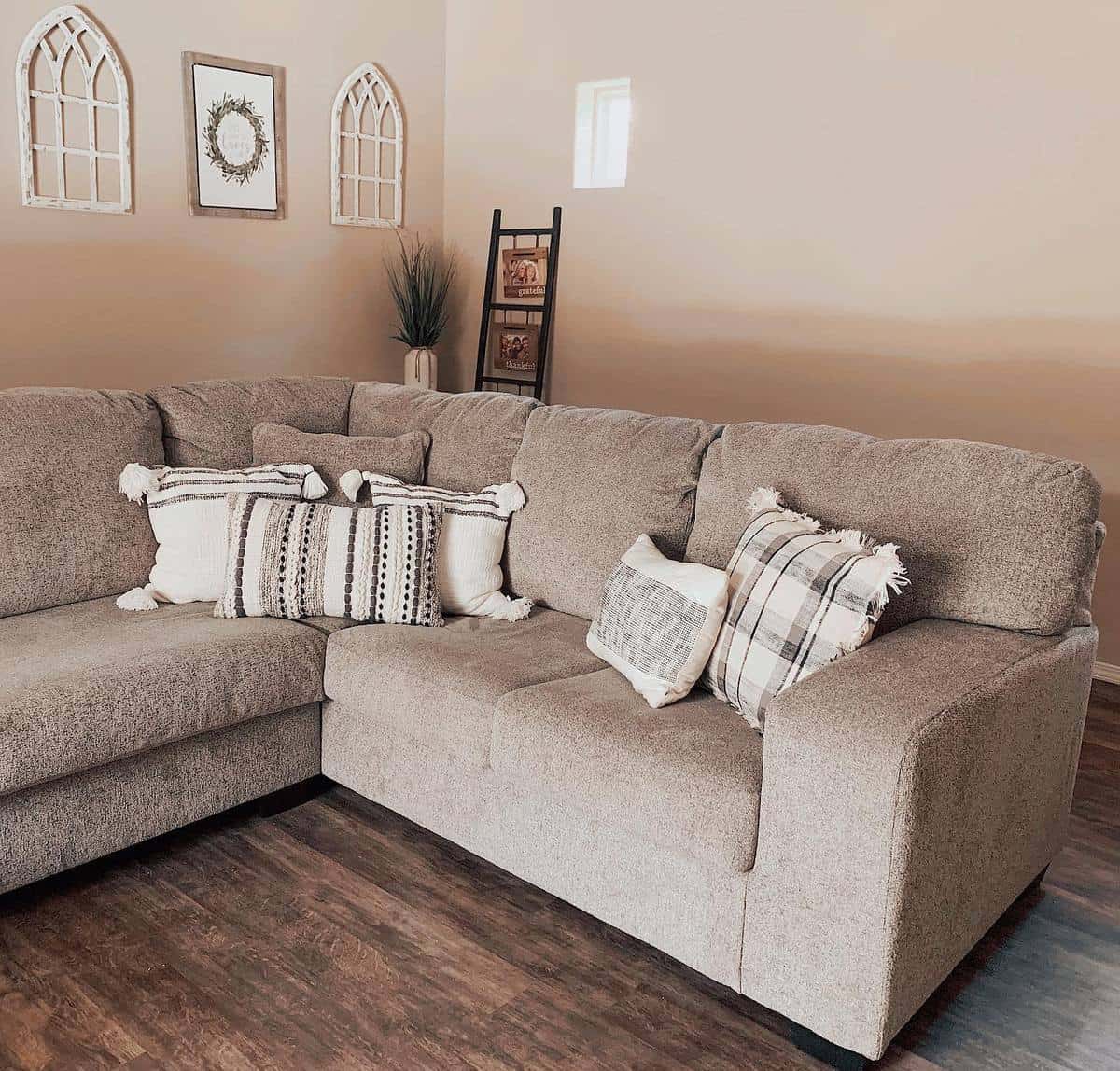 neutral brown living room gray sofa