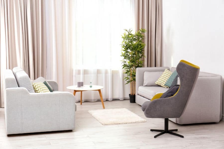 neutral muted color curtains with sofa and accent chair 