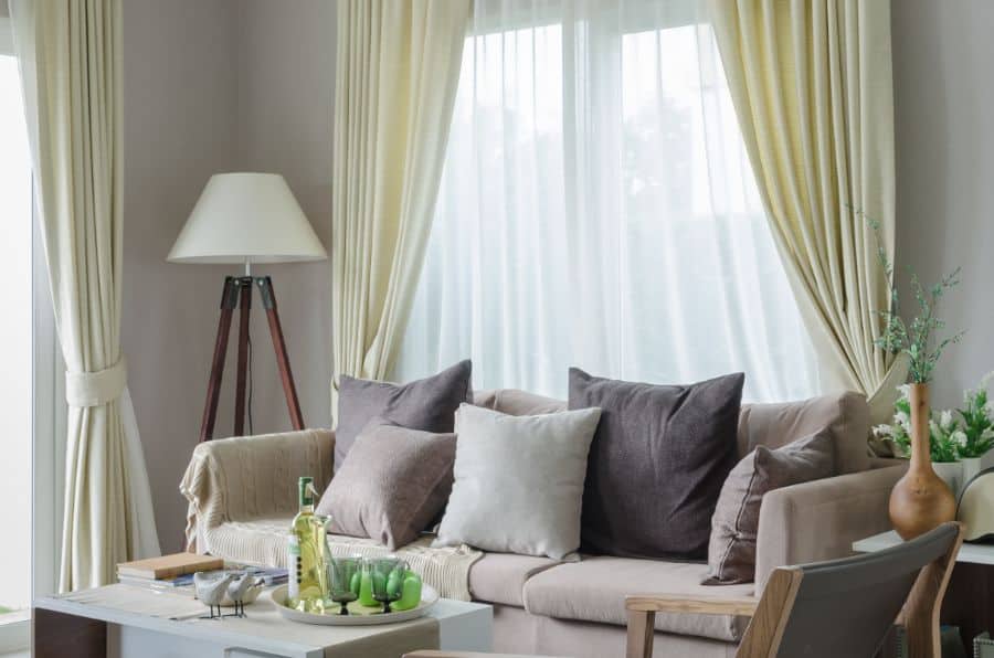 neutral green curtains gray sofa living room 