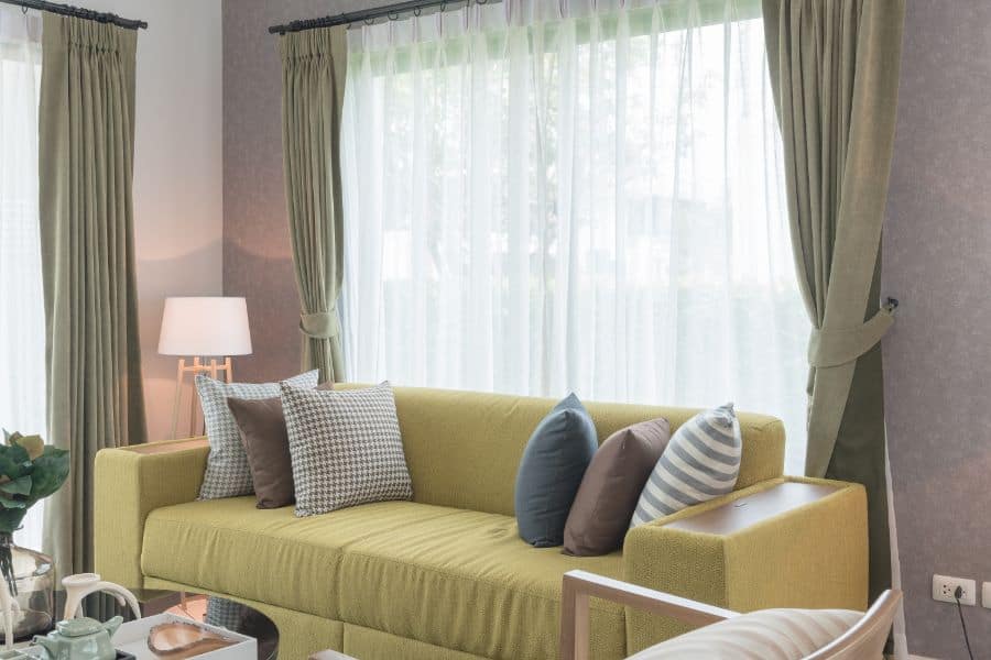 soft green curtains yellow sofa living room