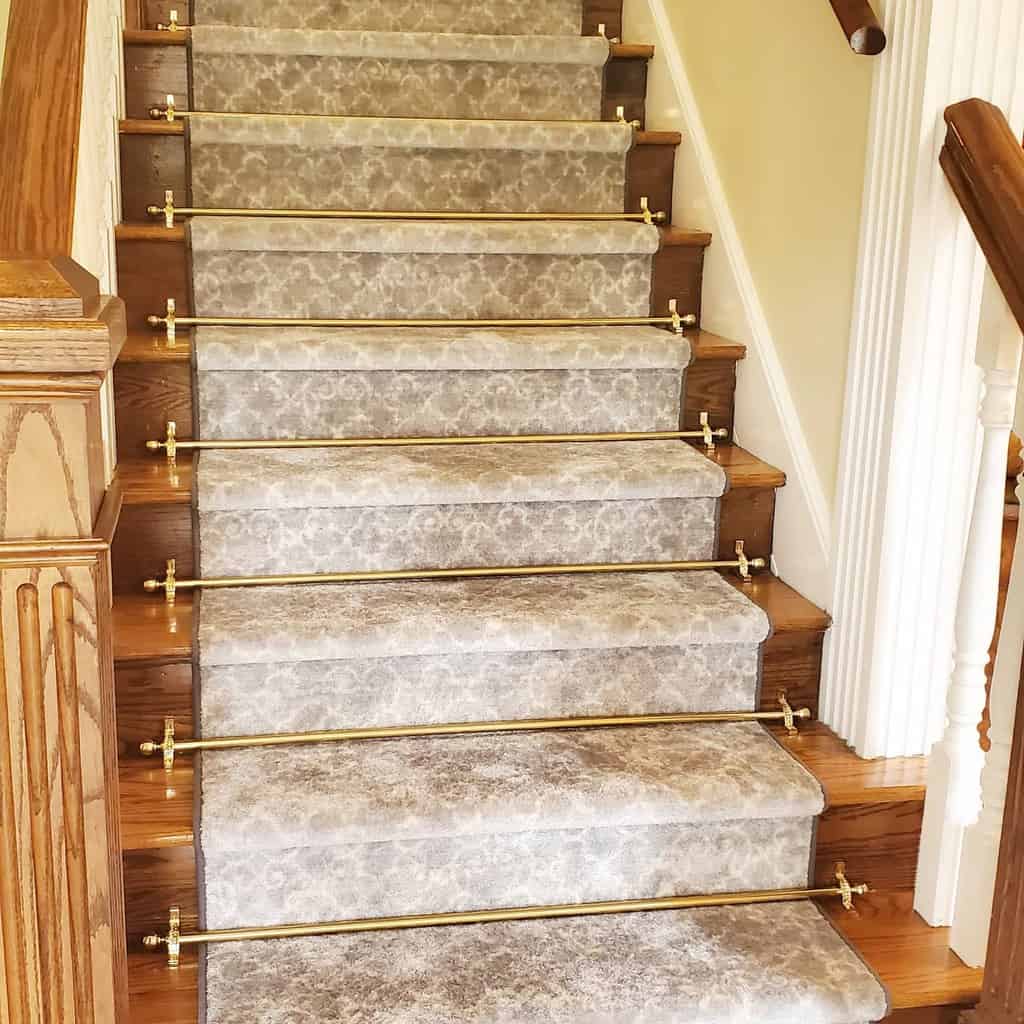gray pattern stair runner with ornate decorations 
