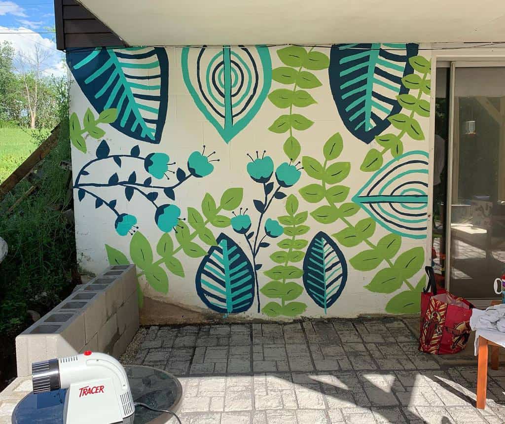 green and blue fauna outside wall mural 