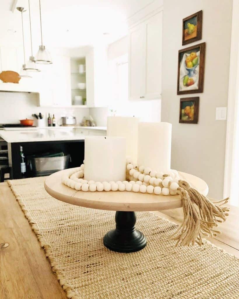 small decorative table with candles and beads on kitchen table 