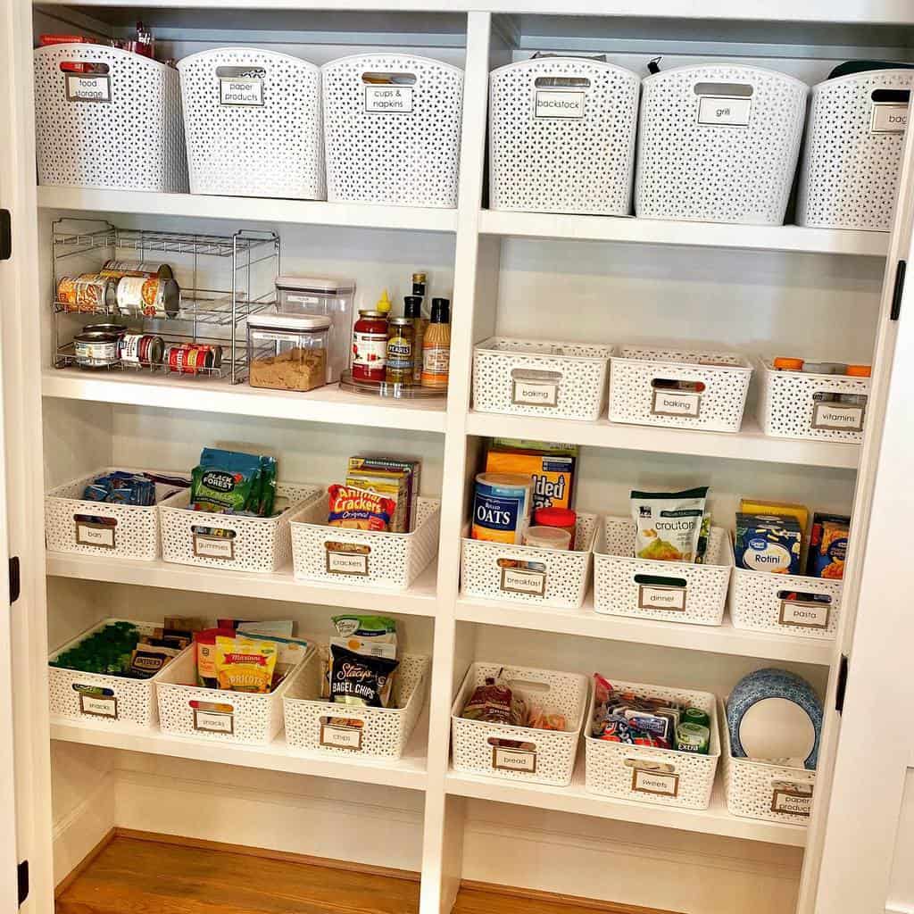 white pantry kitchen with organized shelves and baskets 