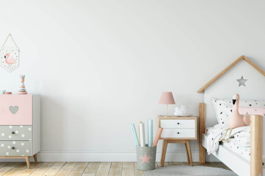 white wall pastel girls room wood bed and side table 