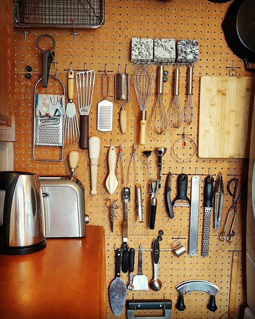 pegboard kitchen organization wall holding utensils