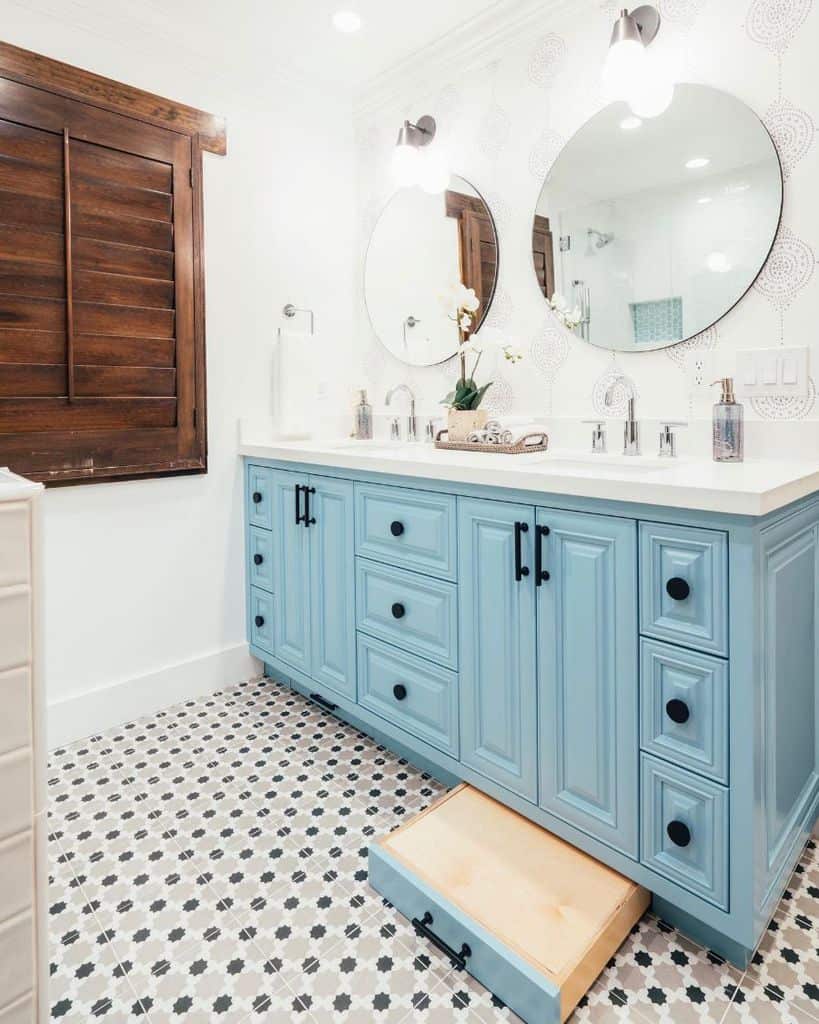 blue wood bathroom vanity dual sinks and wall mirrors pattern tile floor