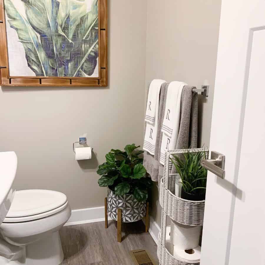 small powder room with framed wall art