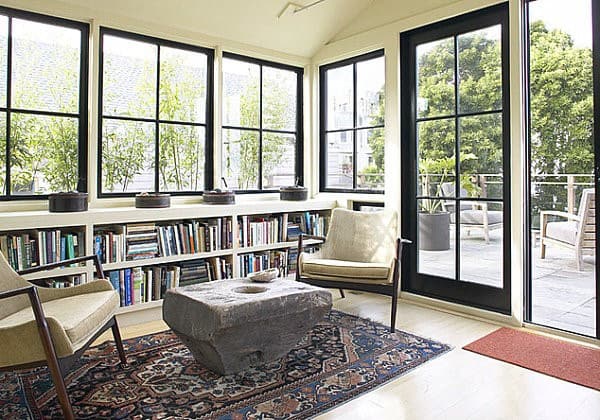 modern sunroom bookshelf large windows