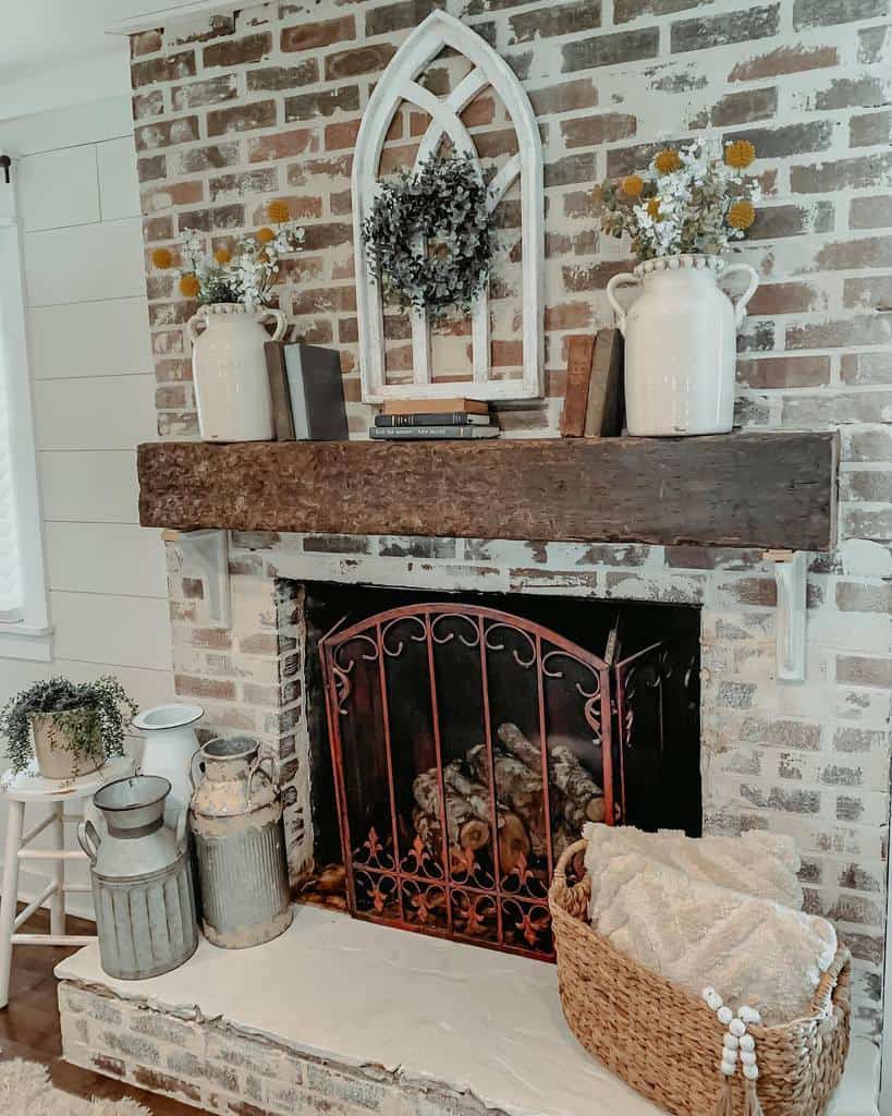 rustic brick fireplace wood plank mantle iron fire grill 