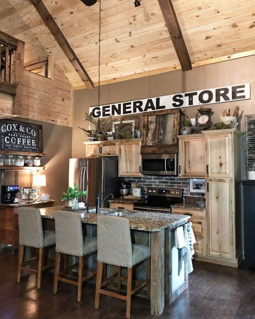 rustic kitchen high vaulted ceiling general store sign wood cabinets 