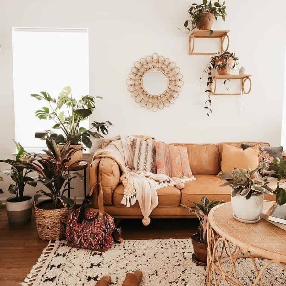 rustic boho living room tan leather sofa plants 