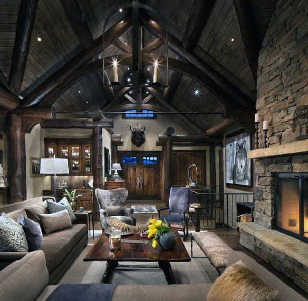 cabin living room stone fireplace gray couch