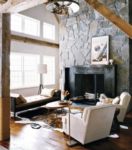 small modern living room stone fireplace animal hide floor rug