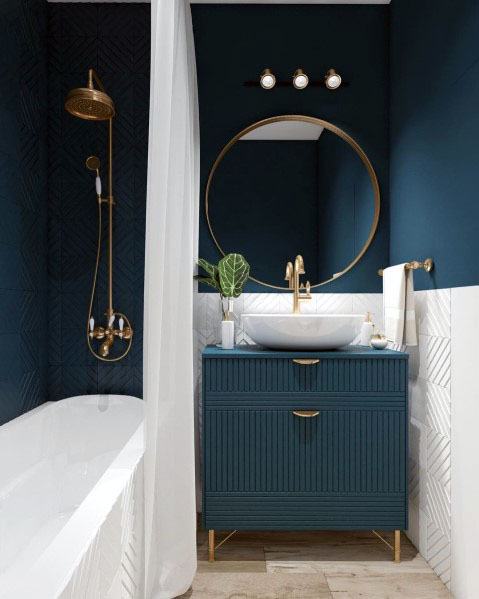 luxury small master bathroom with blue walls and gold accents 
