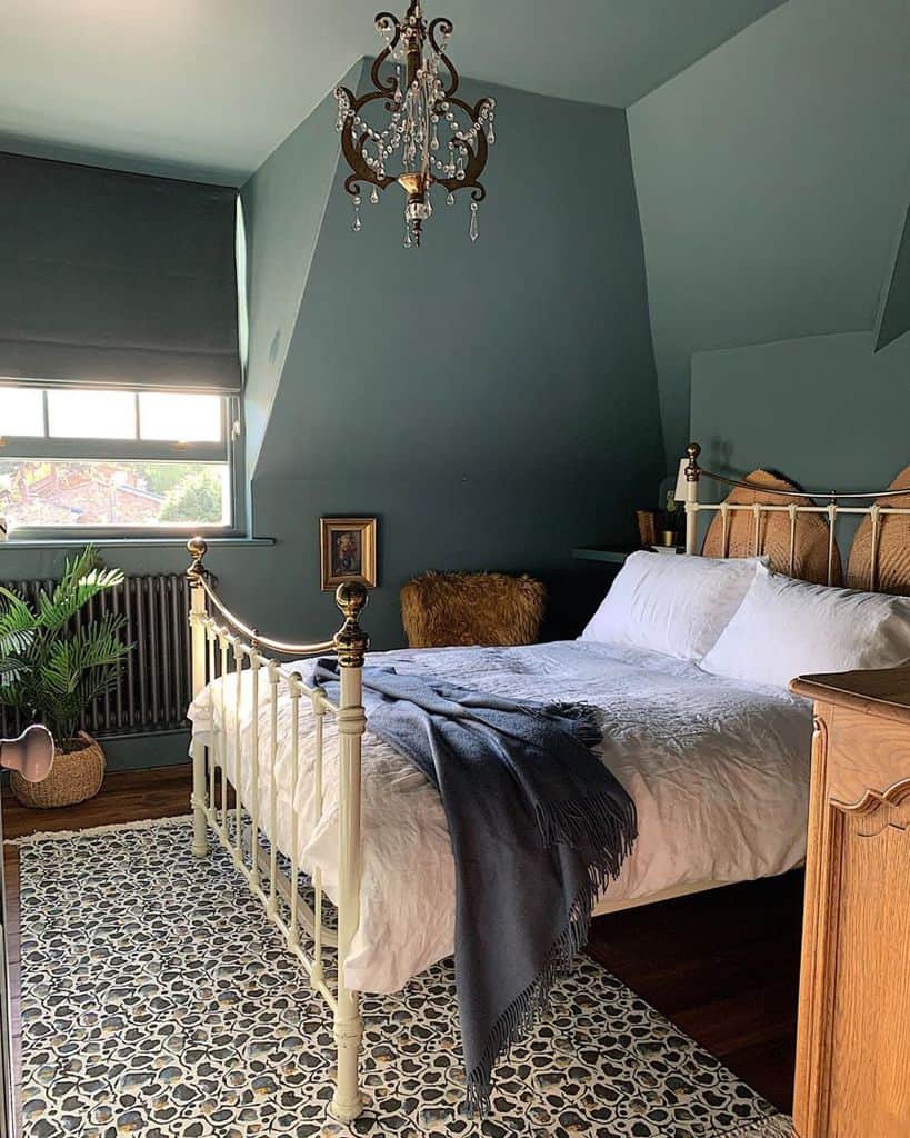 retro green wall attic bedroom with four post bed 