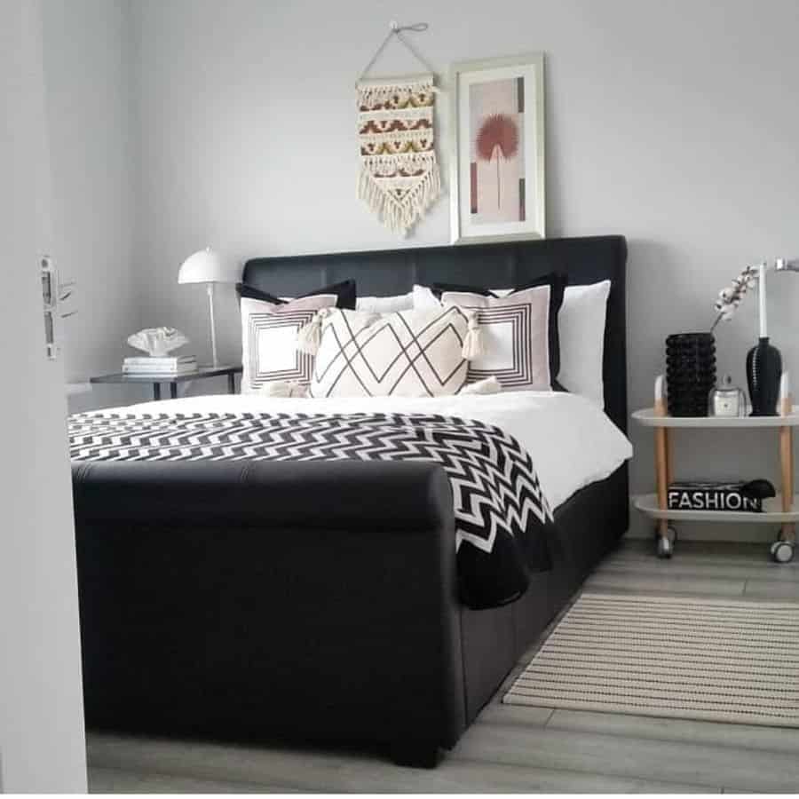 black frame bed in small gray modern bedroom 