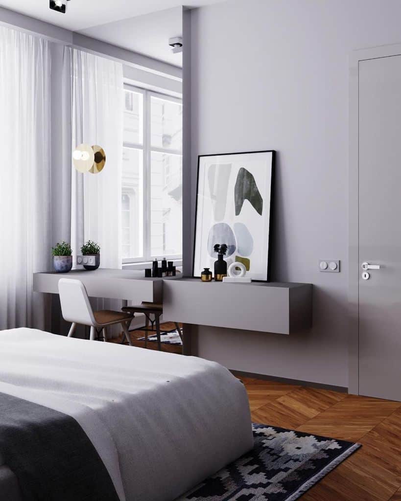 gray bedroom with vanity and large wall mirror 