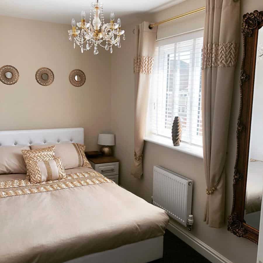 elegant neutral color bedroom with chandelier