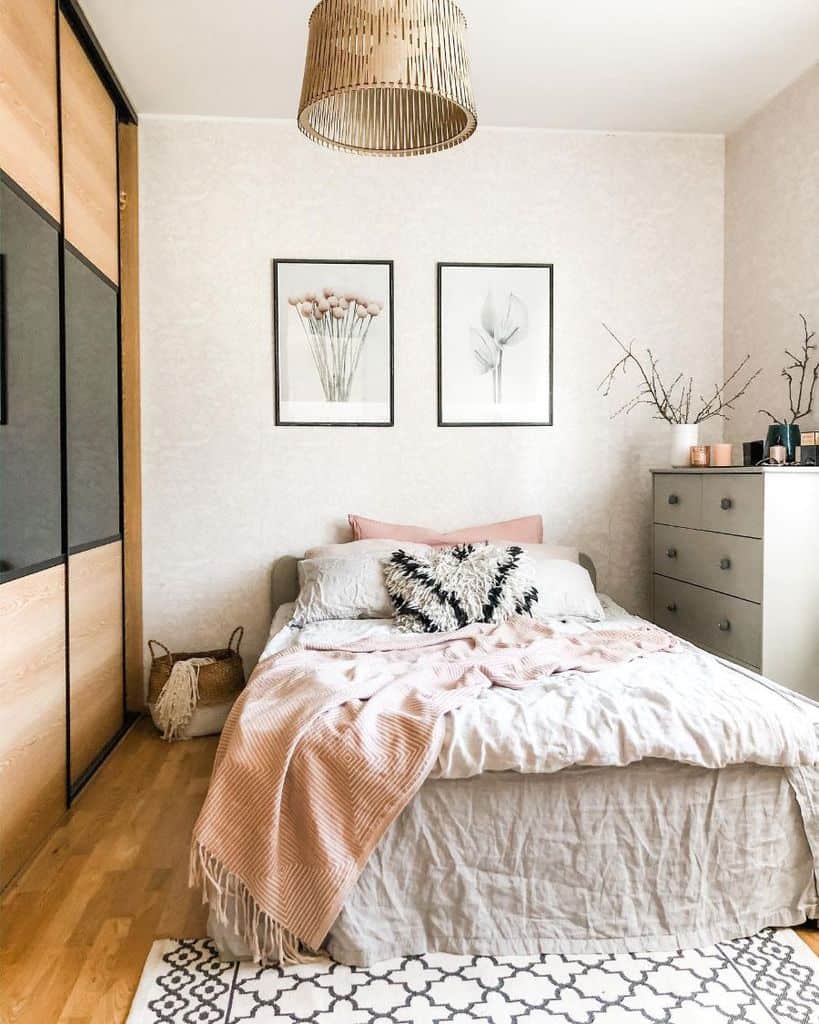 small bedroom with platform bed and white cabinet 
