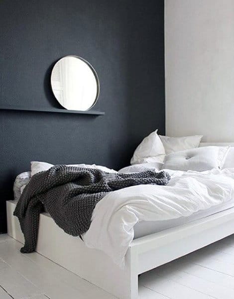 minimalist small master bedroom with black accent wall