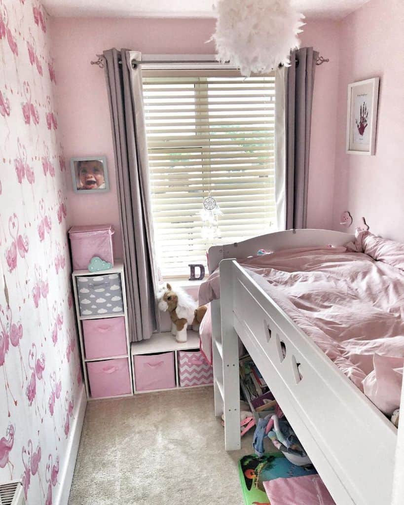 small girls bedroom with pink wall 