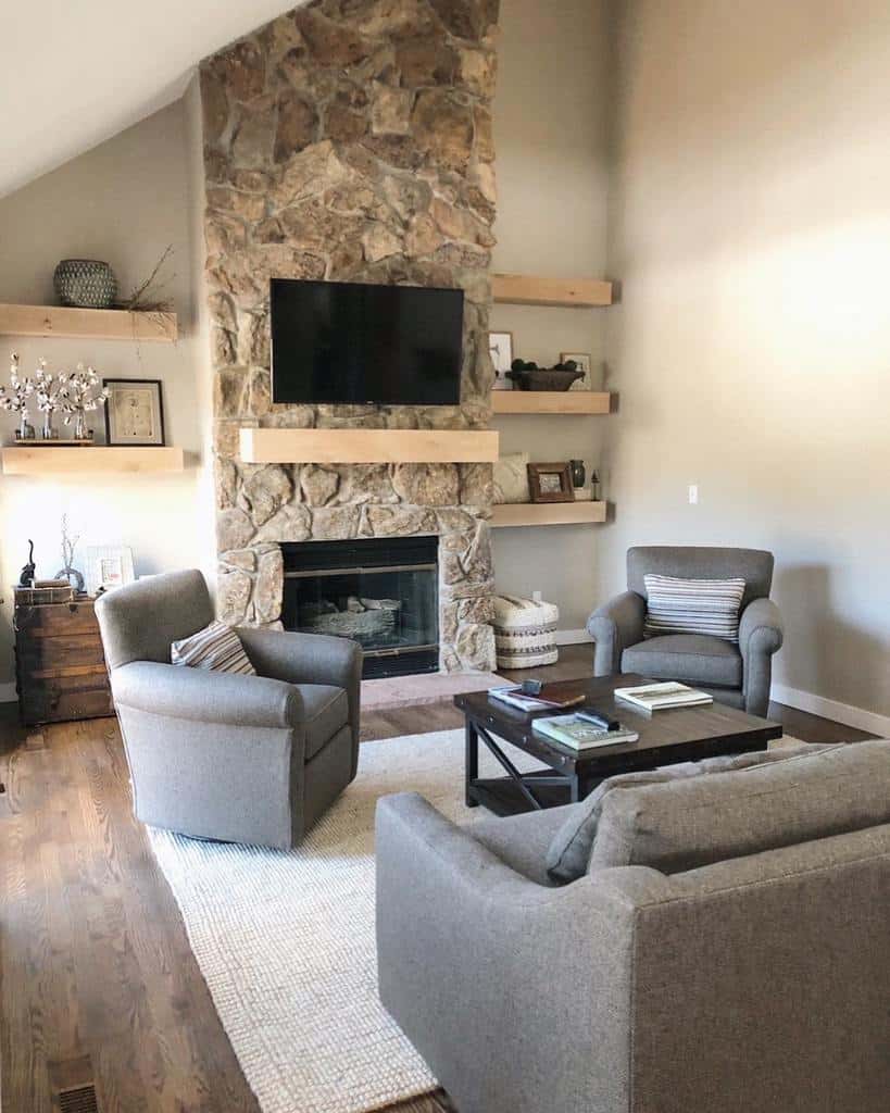 small living room stone fireplace tv wood shelves 