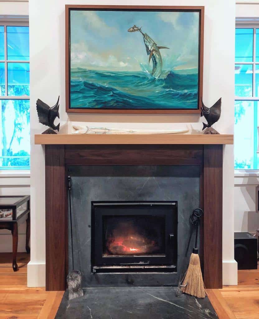 traditional fireplace fish statues painting of leaping fish 
