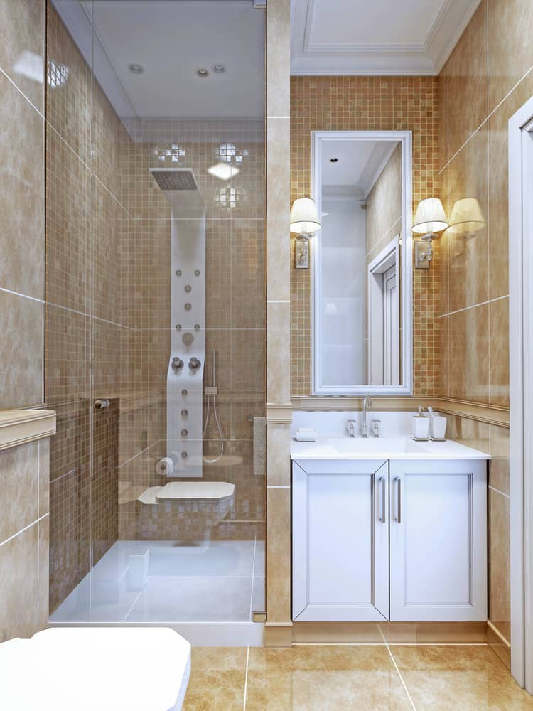 mosaic tile bathroom with white cabinets 