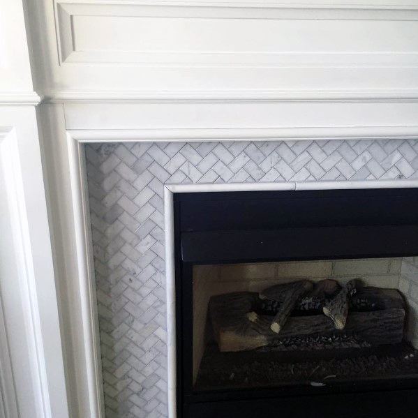 herringbone-patterned fireplace tiles