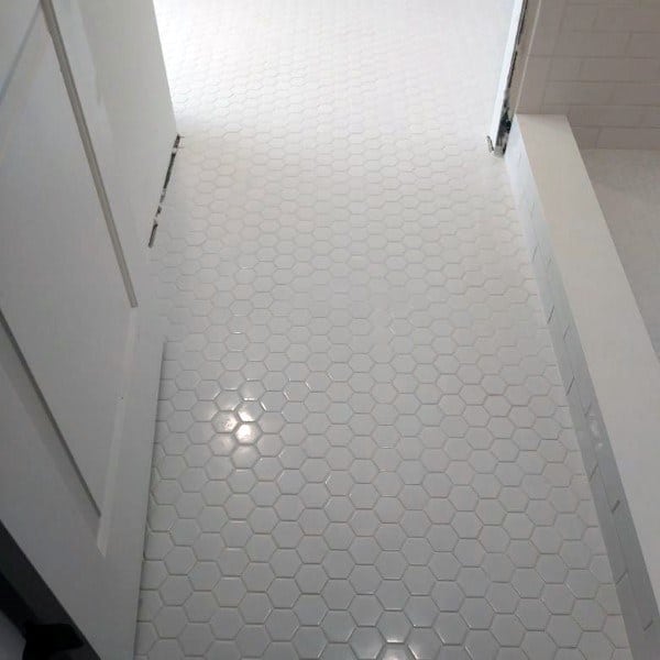 white hexagonal bathroom floor tiles