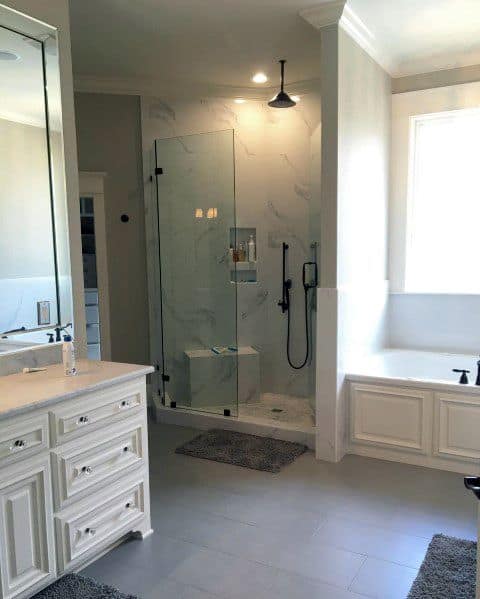 large bathroom with white cabinets 
