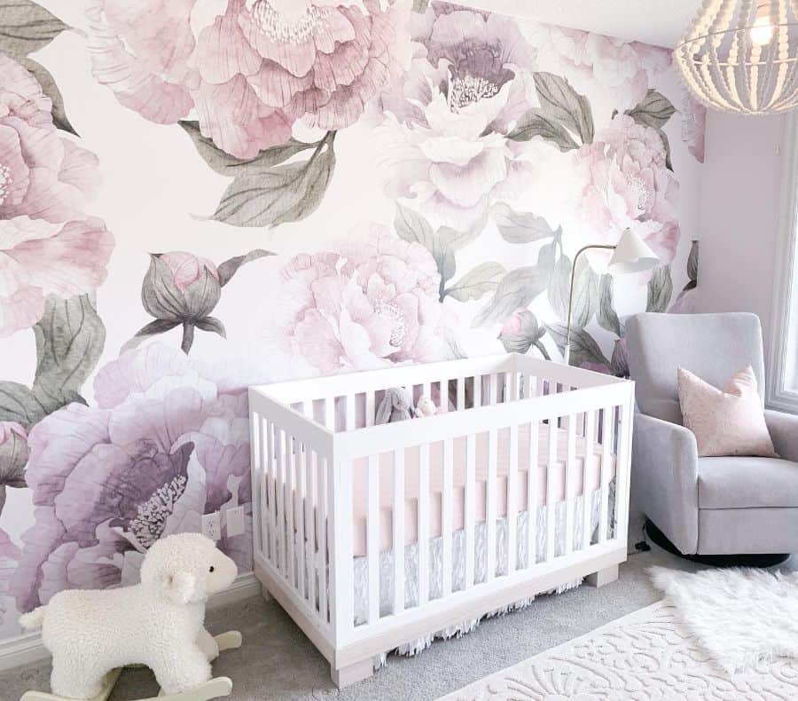 rose statement wall in charming baby's bedroom.