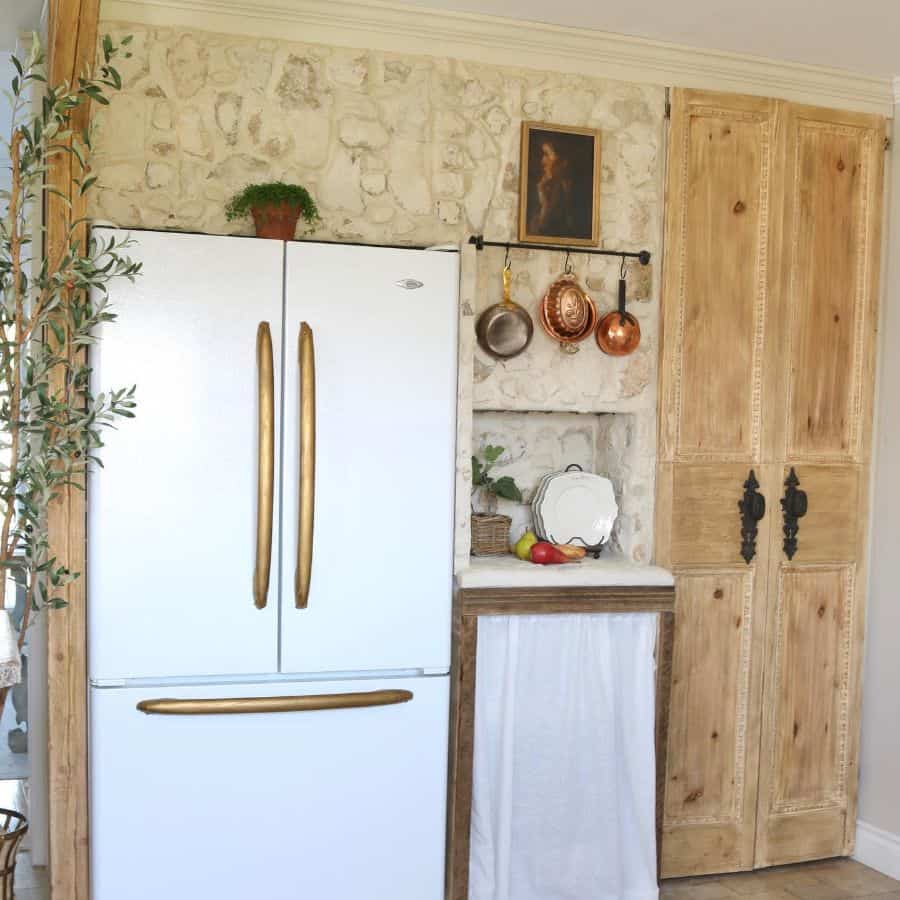 country kitchen wood cabinets white fridge gold accents 