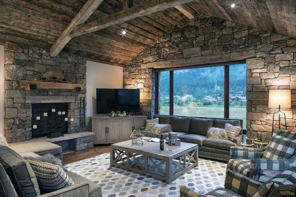 rustic stone living room fireplace gray sofa