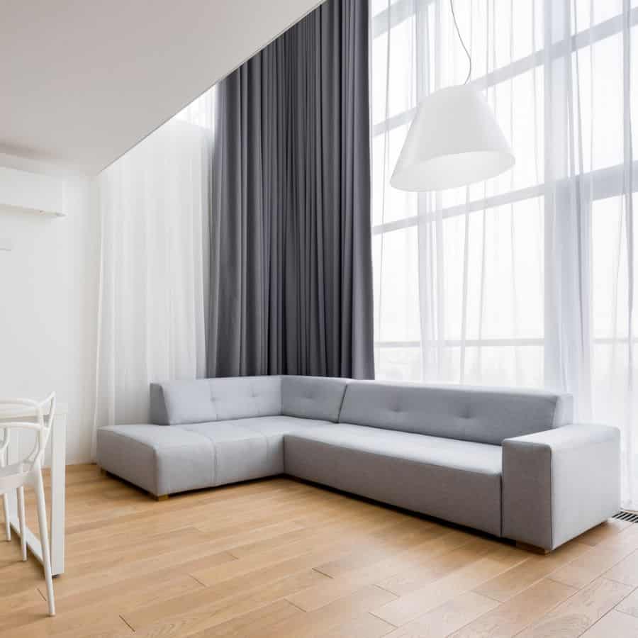 gray corner sofa in apartment living room