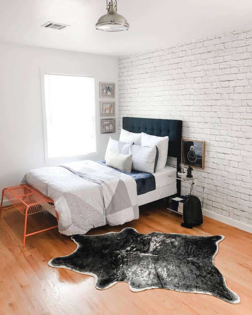 fake white brick wall bedroom floorboards animal skin rug