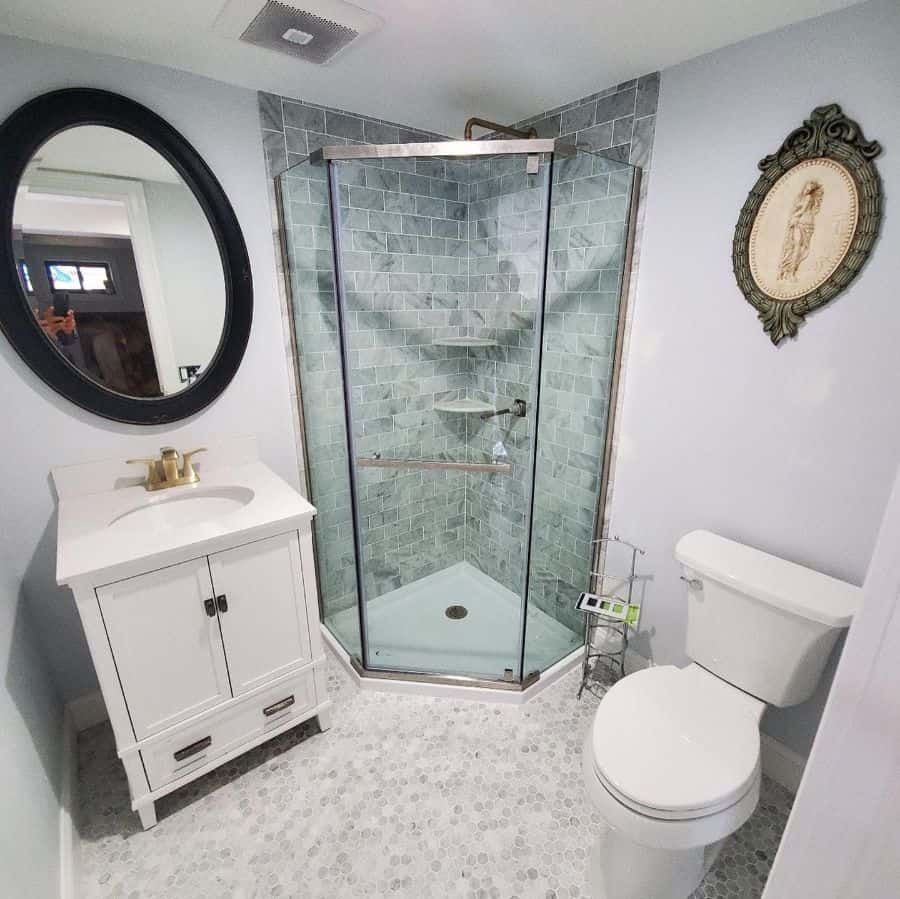 green tiled shower in white bathroom